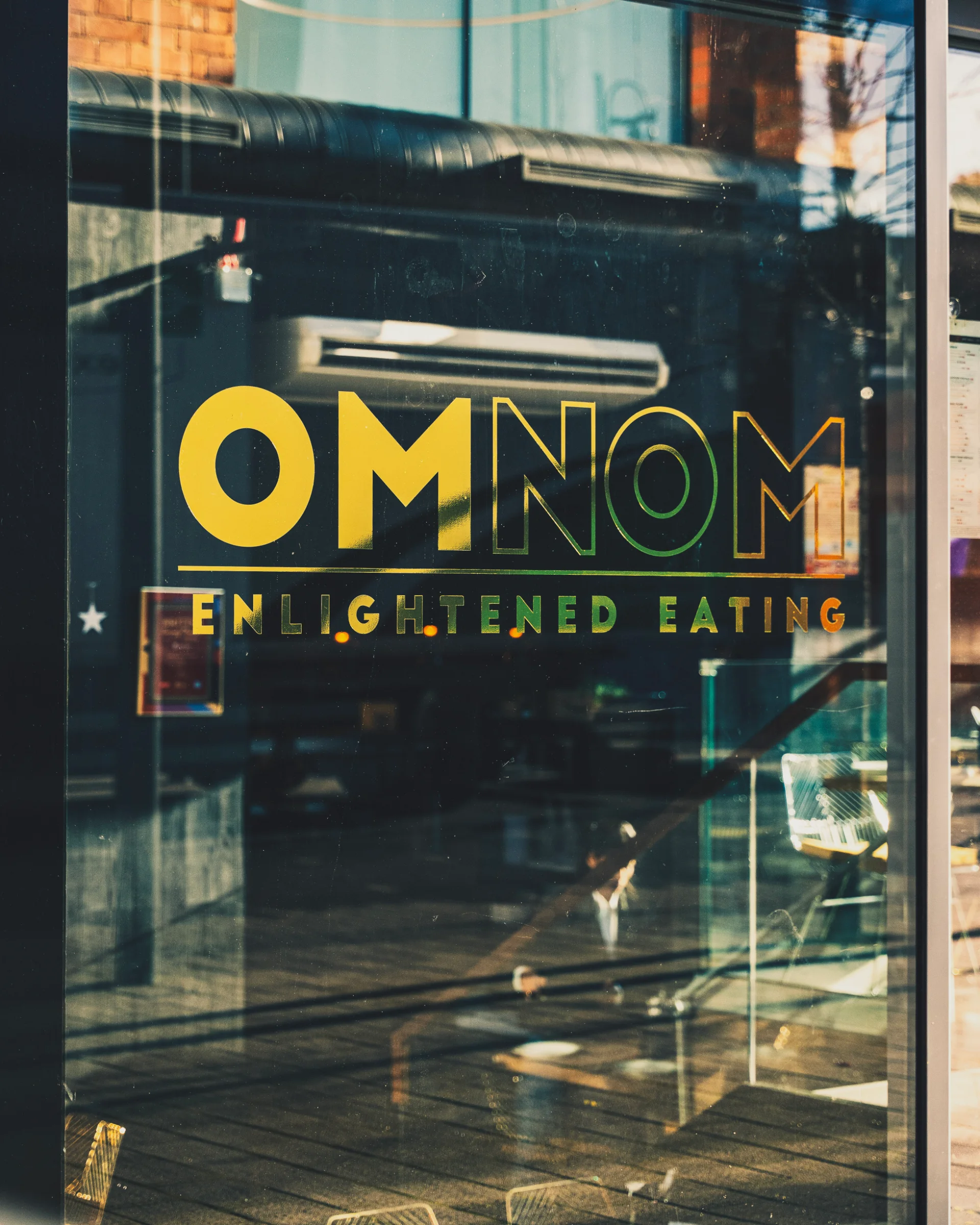 Mindful vegetarian dining and community gathering at OmNom Islington.
